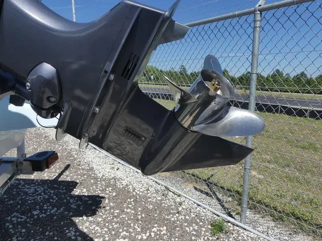 Slide: The Image of Outboard motor propeller of 2025 Key West 188 BR boat near chain-link fence. - 9