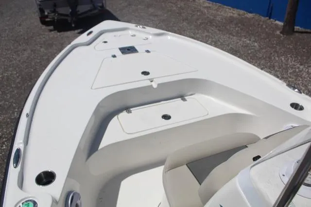 Slide: The Image of 2025 Key West 188 BR boat deck, featuring sleek white design and spacious seating area. - 11