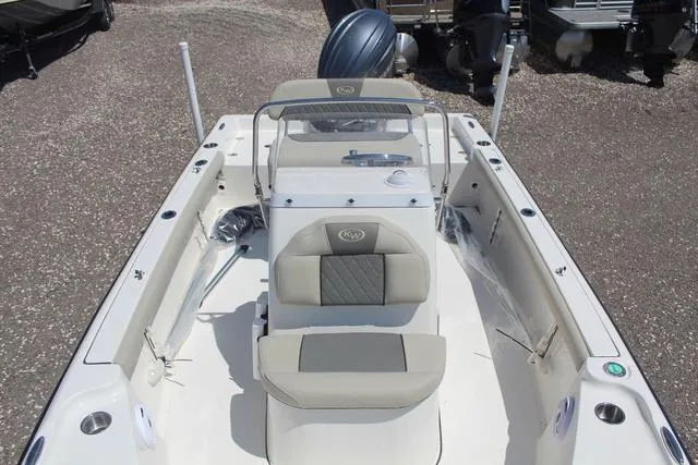 Slide: The Image of 2025 Key West 188 BR boat interior with seating and steering console. - 12