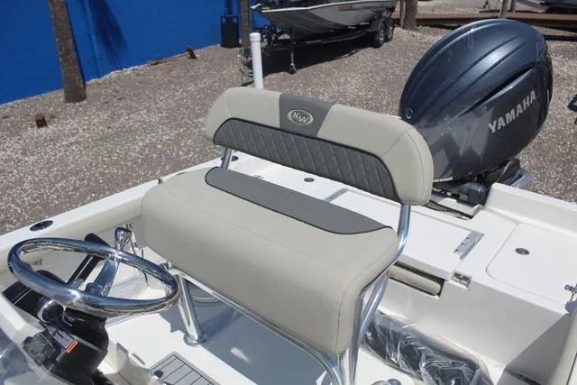 Slide: The Image of 2025 Key West 188 BR boat with Yamaha engine and cushioned seating. - 13
