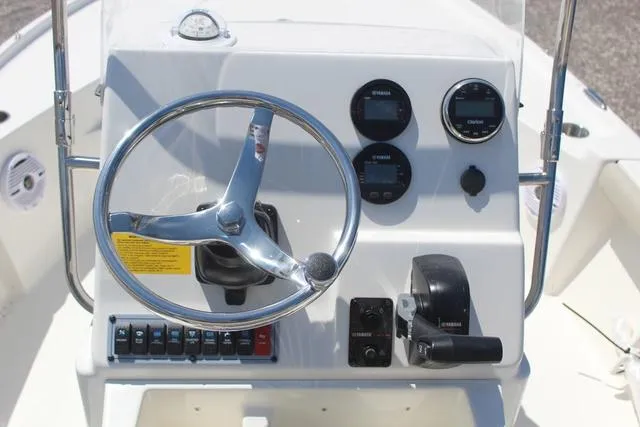 Slide: The Image of 2025 Key West 188 BR boat dashboard with steering wheel and control panel. - 14
