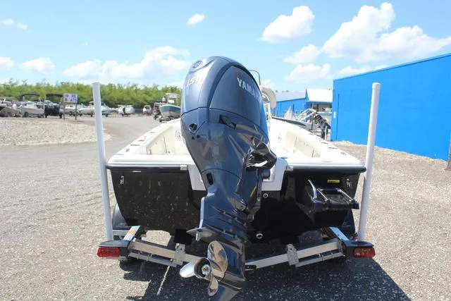 Slide: The Image of 2025 Key West 188 BR boat with Yamaha outboard motor on trailer, sunny day. - 5