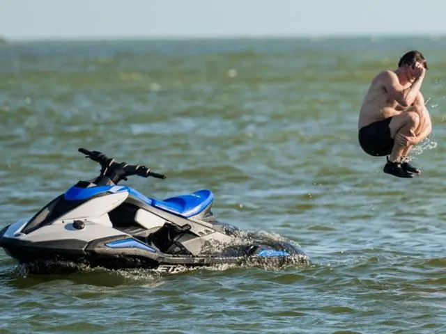 Slide: The Image of Man jumping off 2025 Yamaha Waverunner Jetblaster in the ocean. - 10