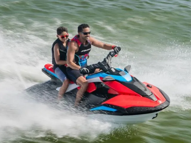 Slide: The Image of Two people riding a 2025 Yamaha Waverunner Jetblaster on water. - 11
