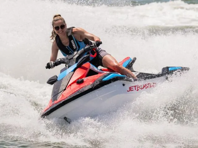 Slide: The Image of 2025 Yamaha Waverunner Jetblaster in action on the water, rider enjoying the waves. - 12