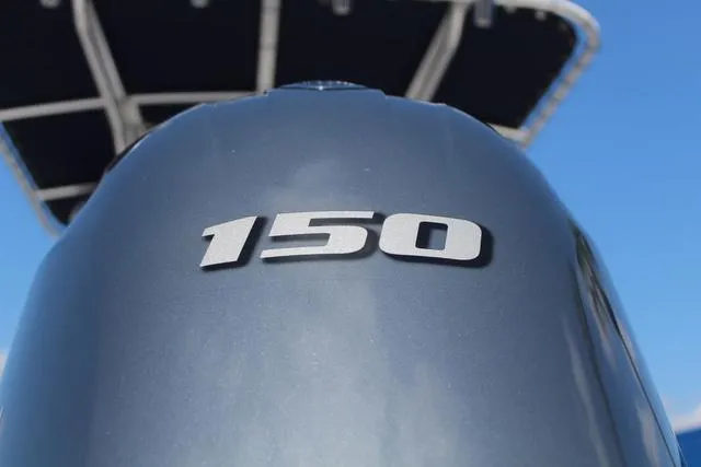 Slide: The Image of Close-up of 2022 Robalo R200 outboard motor with '150' horsepower marking. - 10