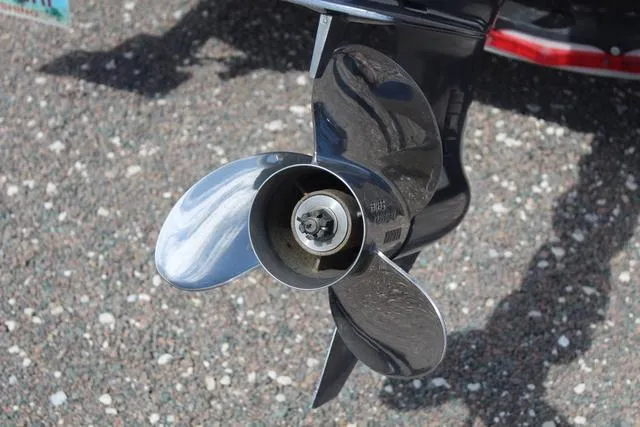 Slide: The Image of Propeller of 2022 Robalo R200 boat on gravel surface. - 13