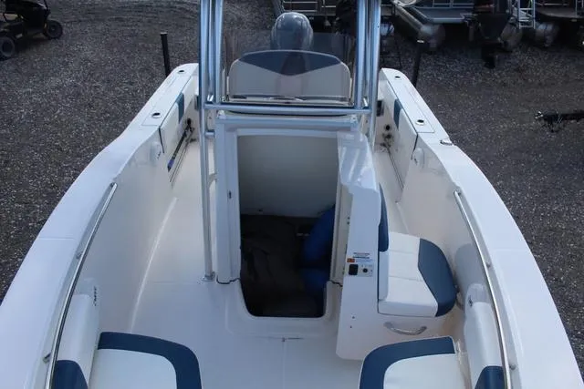 Slide: The Image of 2022 Robalo R200 boat interior with seating and console, viewed from above. - 18