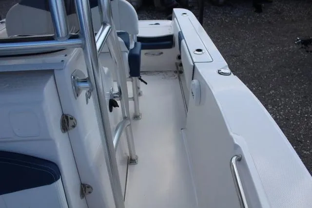 Slide: The Image of 2022 Robalo R200 boat interior with seating and railing. - 20