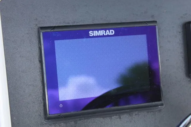 Slide: The Image of Simrad display screen on 2022 Robalo R200 boat dashboard. - 24