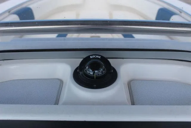 Slide: The Image of Compass on 2022 Robalo R200 boat dashboard, featuring Ritchie brand. - 27
