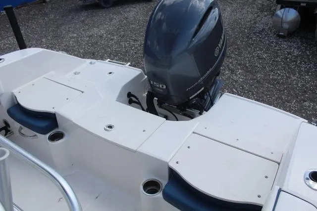 Slide: The Image of 2022 Robalo R200 boat with Yamaha 150 engine, white deck, and seating. - 28