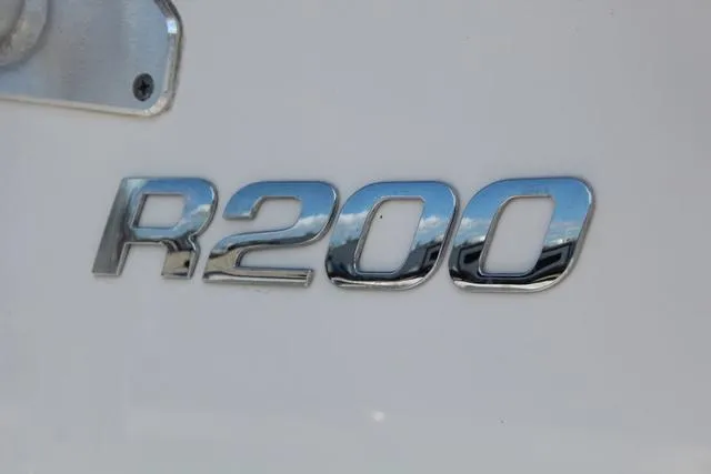 Slide: The Image of Chrome "R200" emblem on a 2022 Robalo boat. - 9