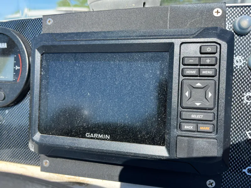 Slide: The Image of Garmin marine GPS device on Apex A-11 Tender, 2014 model, with control buttons. - 11