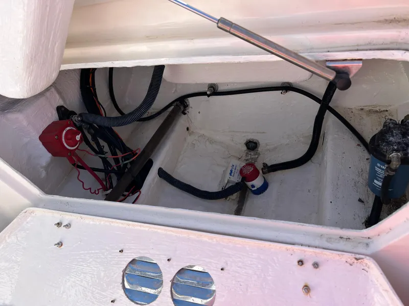 Slide: The Image of Open engine compartment of 2014 Apex A-11 Tender boat showing wiring and components. - 13