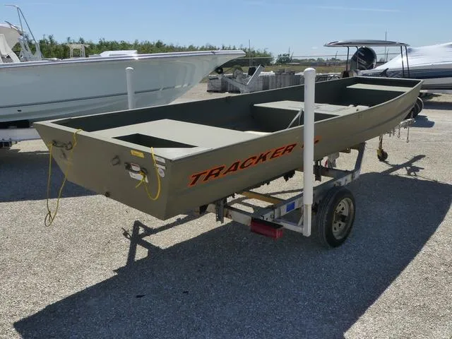 Slide: The Image of 2025 Tracker Grizzly® 15 Jon boat on trailer, parked outdoors. - 6