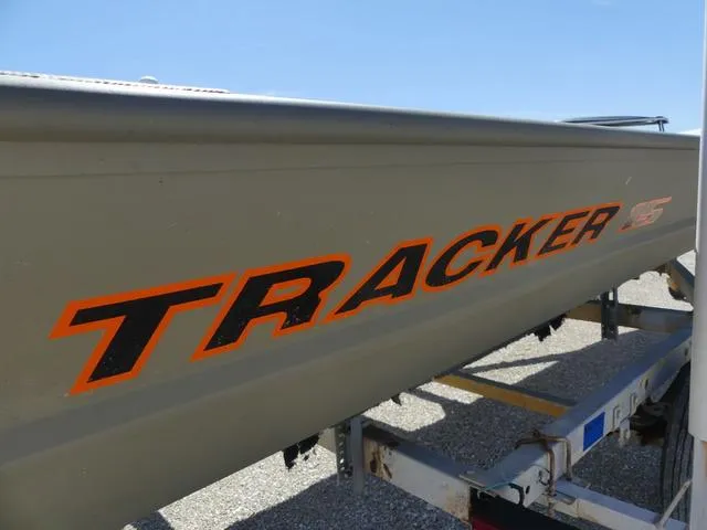 Slide: The Image of 2025 Tracker Grizzly® 15 Jon boat on trailer, featuring bold orange lettering. - 8