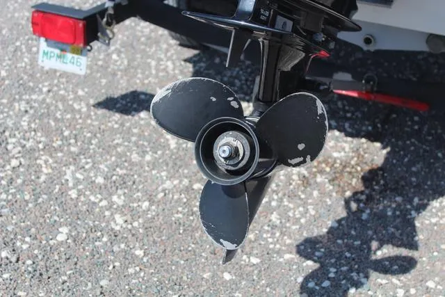 Slide: The Image of Propeller of 2021 Tracker Pro Team 175 TXW® Tournament Edition boat on gravel surface. - 10