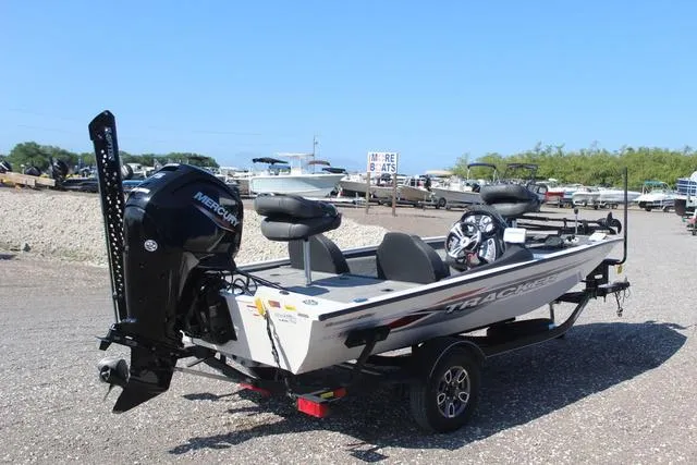 Slide: The Image of 2021 Tracker Pro Team 175 TXW Tournament Edition boat on trailer, parked outdoors. - 4