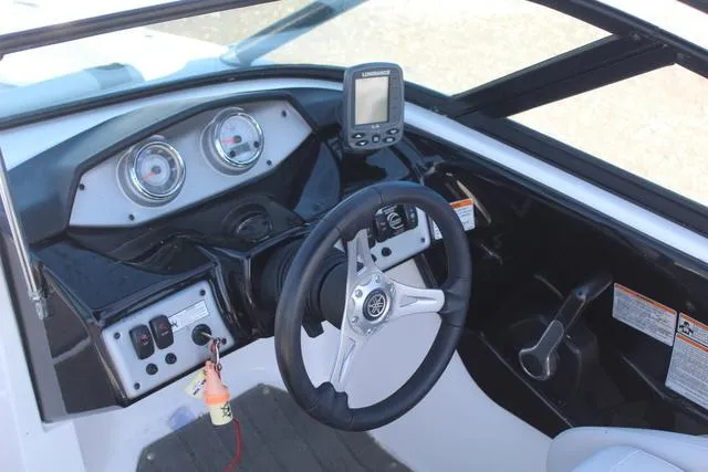 Slide: The Image of 2014 Yamaha Boats AR192 dashboard with steering wheel and gauges. - 10