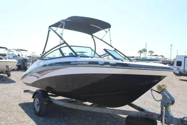 Slide: The Image of 2014 Yamaha Boats AR192 on trailer, black and white design, parked outdoors. - 3