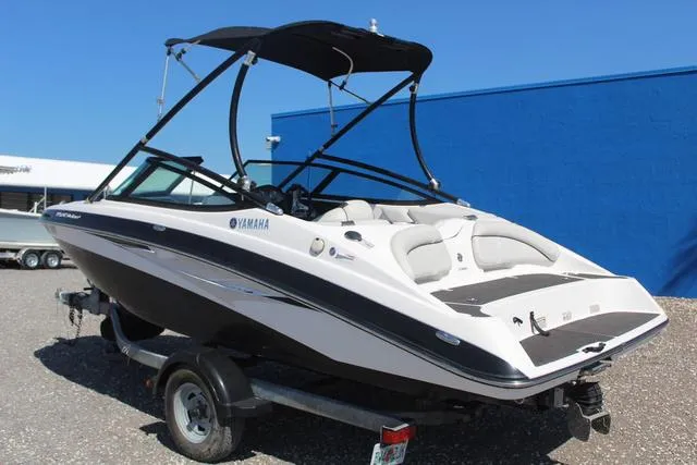 Slide: The Image of 2014 Yamaha AR192 boat on trailer, black and white design, with canopy. - 6