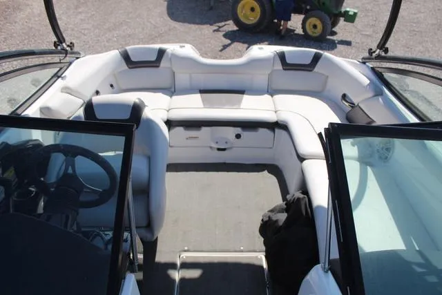 Slide: The Image of 2014 Yamaha Boats AR192 interior with white seating and steering wheel. - 9