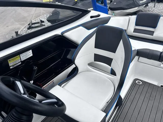 Slide: The Image of 2020 Yamaha AR210 boat interior with steering wheel and seating. - 19