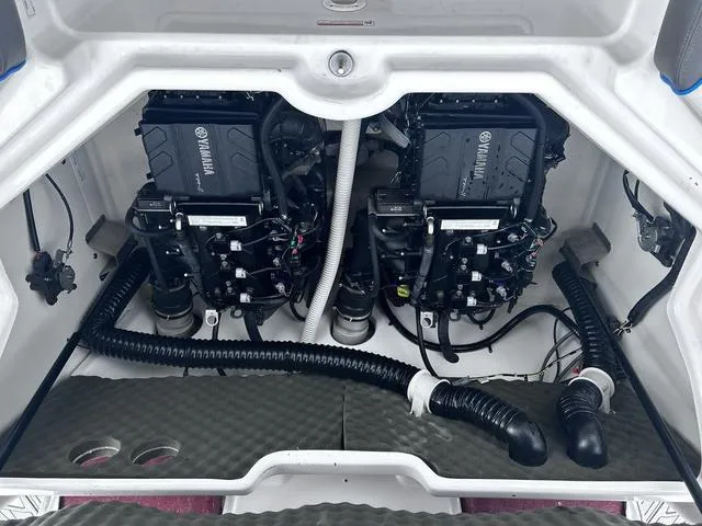 Slide: The Image of 2020 Yamaha AR210 boat engine compartment with dual engines and wiring. - 21