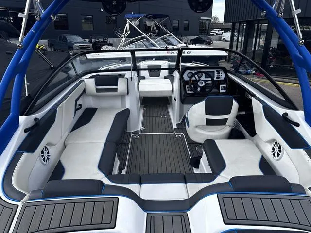 Slide: The Image of 2020 Yamaha AR210 boat interior with sleek seating and modern dashboard design. - 8