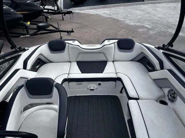Slide: The Image of 2015 Yamaha Boats AR192 interior with white seating and black accents. - 14