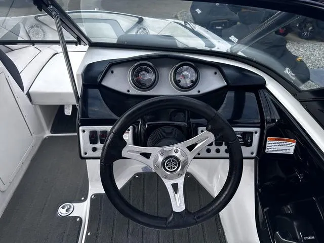 Slide: The Image of 2015 Yamaha AR192 boat dashboard with steering wheel and gauges. - 15