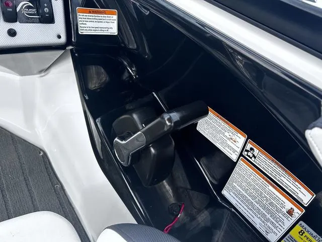 Slide: The Image of Control panel of a 2015 Yamaha Boats AR192 with safety warnings and throttle lever. - 16