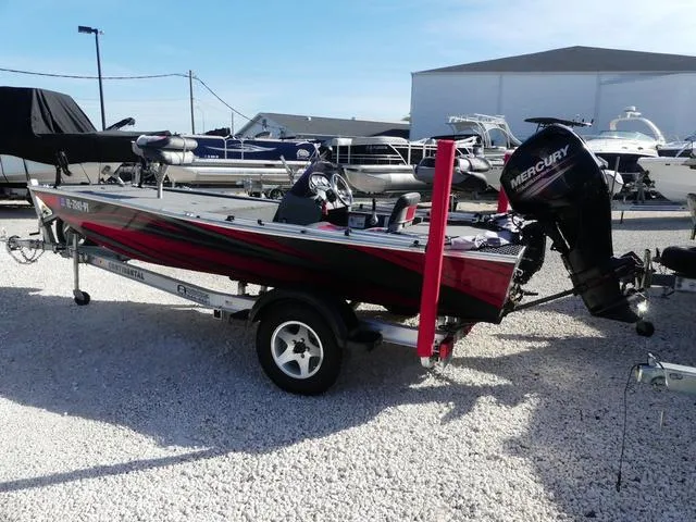 Slide: The Image of 2014 Tracker Pro 170 boat with Mercury engine on trailer, parked in a marina. - 4