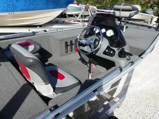 Slide: The Image of 2014 Tracker Pro 170 boat interior with steering console and seating. - 6
