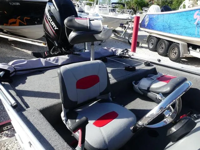 Slide: The Image of 2014 Tracker Pro 170 boat interior with seating and steering wheel. - 7