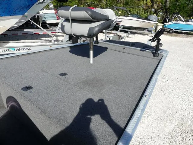 Slide: The Image of 2014 Tracker Pro 170 boat deck with seat and fishing rod holder. - 8