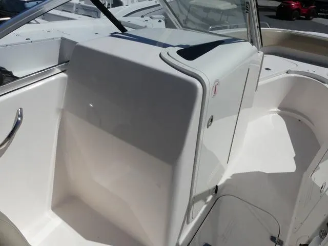 Slide: The Image of 2015 Pursuit Boats DC 235 interior, featuring sleek white design and modern controls. - 13