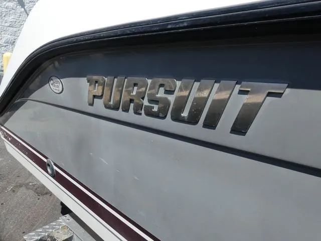 Slide: The Image of 2015 Pursuit Boats DC 235, close-up of logo on boat hull. - 5