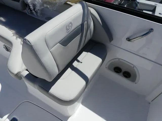 Slide: The Image of 2025 Hurricane SunDeck 235 OB boat seat with white upholstery and stainless steel handle. - 11