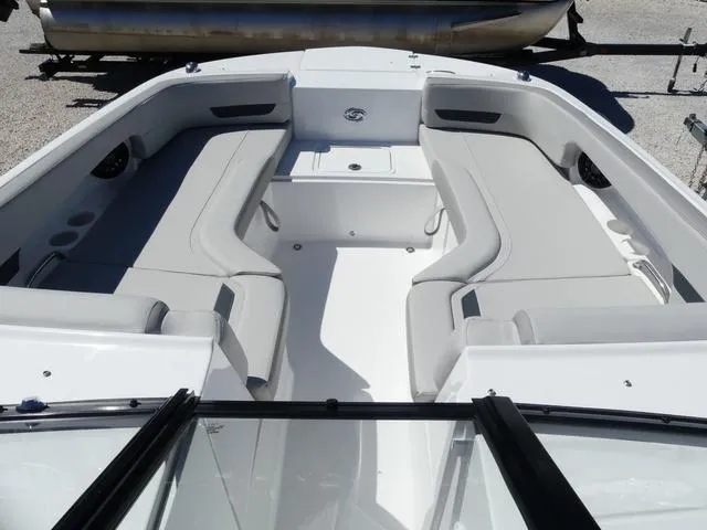 Slide: The Image of 2025 Hurricane SunDeck 235 OB boat interior with spacious seating and modern design. - 14