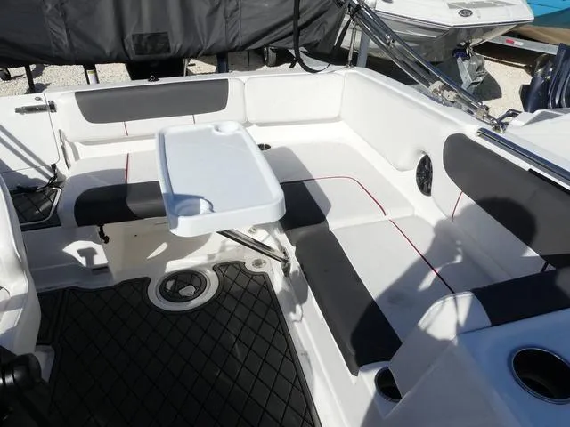 Slide: The Image of 2022 Tahoe 2150 boat interior with seating and table, featuring modern design and comfort. - 14