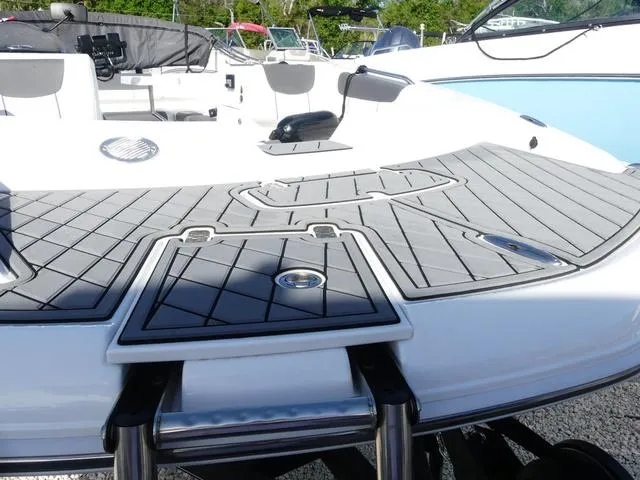 Slide: The Image of 2022 Tahoe 2150 boat deck with seating and swim platform. - 8