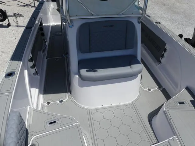 Slide: The Image of 2025 Twin Vee 240 Center Console STX boat interior with seating and controls. - 14
