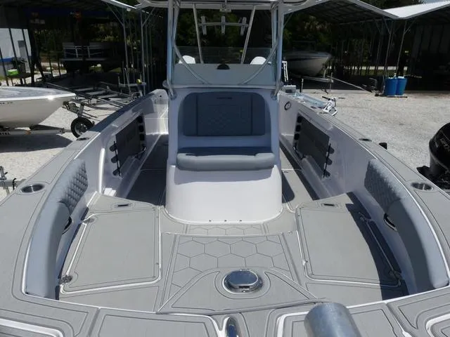 Slide: The Image of 2025 Twin Vee 240 Center Console STX boat seat with gray upholstery and stainless steel frame. - 15