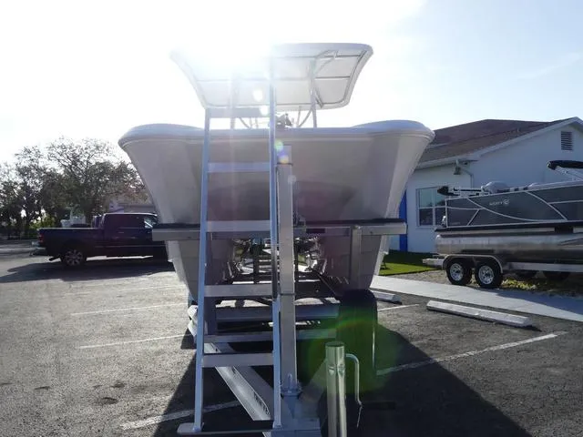 Slide: The Image of 2025 Twin Vee 240 Center Console STX boat storage compartments open on deck. - 18