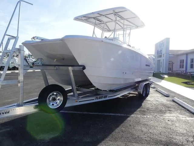 Slide: The Image of 2025 Twin Vee 240 Center Console STX boat interior with bench and cooler storage. - 19