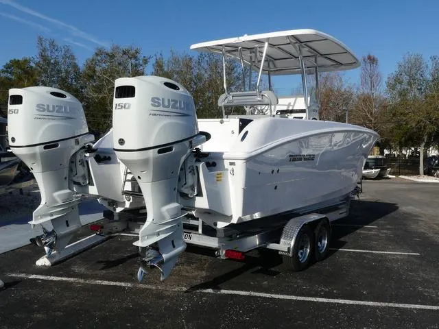 Slide: The Image of 2025 Twin Vee 240 Center Console STX boat interior with seating and storage compartments. - 21