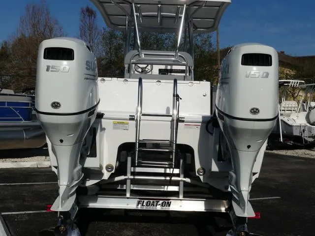 Slide: The Image of 2025 Twin Vee 240 Center Console STX boat interior with seating and storage compartments. - 22