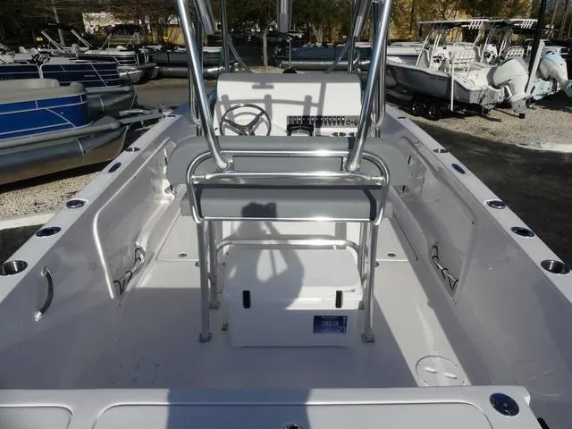 Slide: The Image of 2025 Twin Vee 240 Center Console STX boat interior with seating and storage compartments. - 24